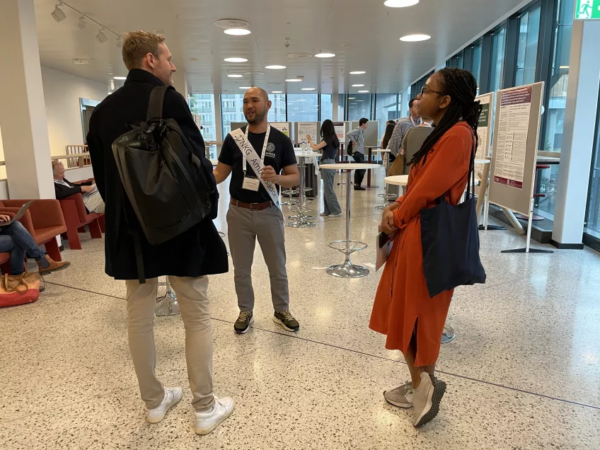 SWEAH PhD students discussing in the poster hall.